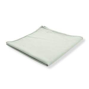 A grey suede cloth folded on a white background