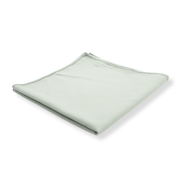 A grey suede cloth folded on a white background