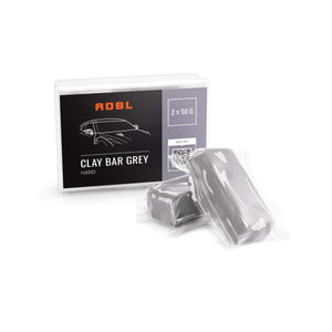 A box of grey hard clay bars in a grey colour