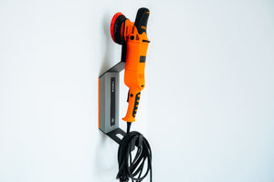 ADBL HANG IT HIGH wall mount holder displaying orange ADBL DA polisher machine