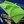 A green microfibre cloth on a blue car