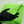 Green microfibre cloth with a black glove on a white car