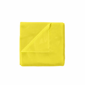 A yellow microfibre towel folded on a white background